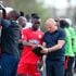 Kenya Police head coach Zdravko Logarusic (right) gives instructions to midfielder David Okoth 