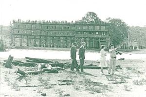 Queen Elizabeth II and Prince Philip (second left) at the site of the old Treetops Hotel