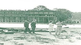 Queen Elizabeth II and Prince Philip (second left) at the site of the old Treetops Hotel
