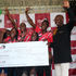 RentCo Africa Founder and Chief Executive Officer Robert Nyasimi hands over a Sh1 million cheque