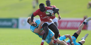 Kenya Sevens player Brian Tanga weaves through Germany's defence