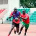 Kevin Imo (left) charges past teammate Nicholas Kiremi 