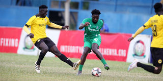 Gor Mahia midfielder Austin Odhiambo (right) vies with Tusker midfielder David Odoyo 