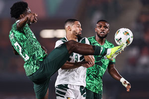Nigeria's defender Ola Aina (left) vies for the ball 