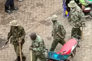 Police officers patrol the streets of Kisii town on Friday.