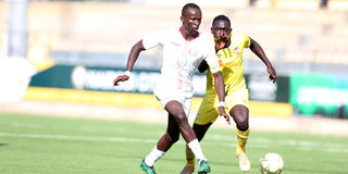 Rainbow FC's Ogam Ryan vies with SS Assad's Harun Junior