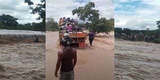 An attempt by some locals to cross the flooded river in a lorry ended in disaster when the vehicle was swept away.