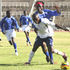 Sofapaka defender Zablon Amanaka (behind) challenges Ulinzi Stars striker Evans Amuoka