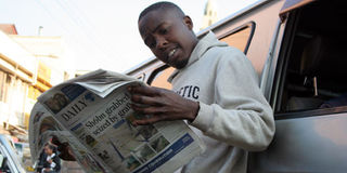 Daily Nation newspaper reader